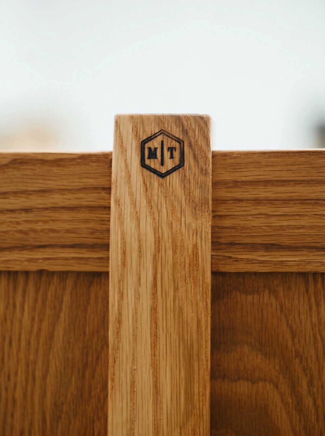 Troutman Woodworks MT maker's mark branded into white oak
